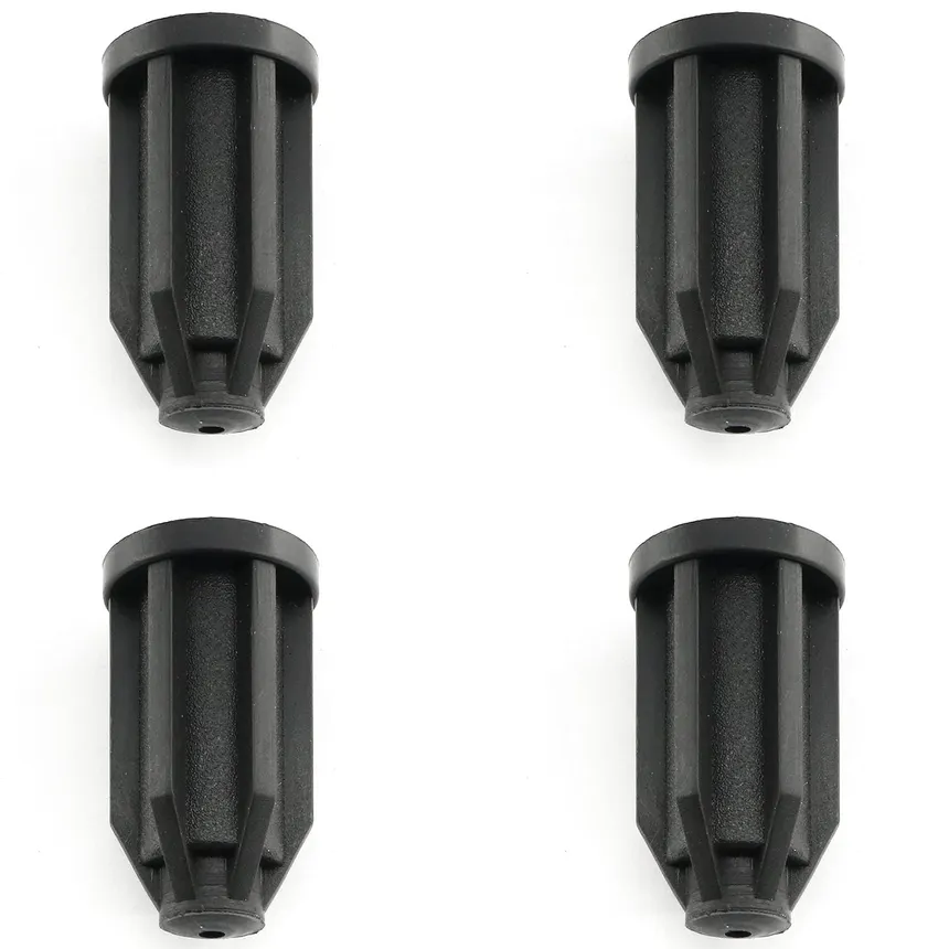 Four black plastic caster socket inserts.